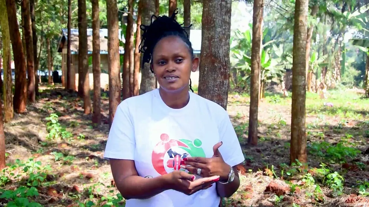 A Build Lives team member speaking at a tree-planting site